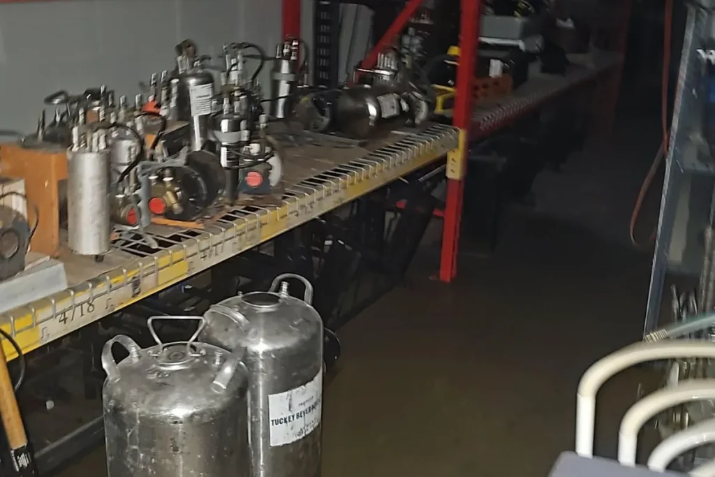 Flooded storage area with standing water after sump pump failure — GTA Restoration emergency water extraction and drying.